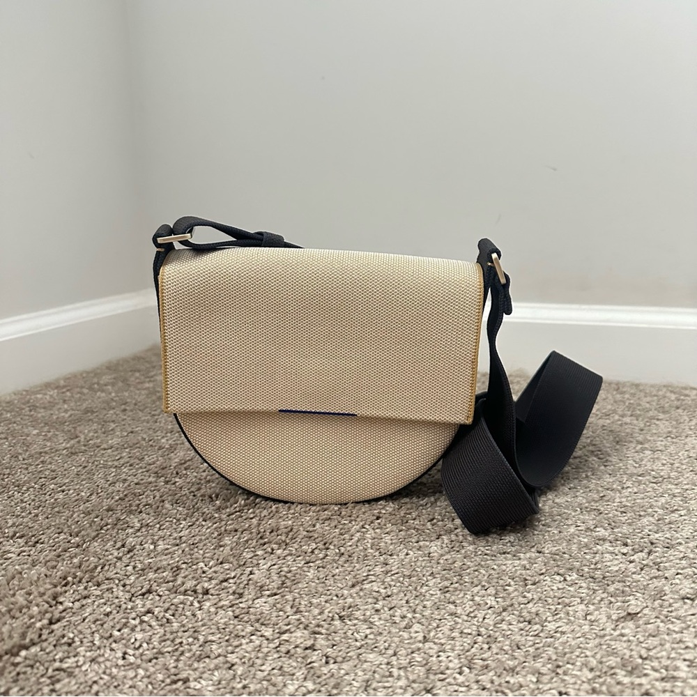 Rothy’s Cream and Black Saddle Bag